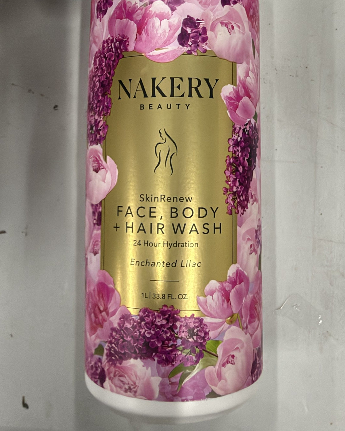 Nakery Beauty SkinRenew Face, Body + Hair Wash Enchanted Lilac 1 L bottle, front label