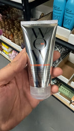 Color Wow Color Security Shampoo in hand, second view