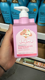 The Crème Shop strawberry body cleanser in hand, second view