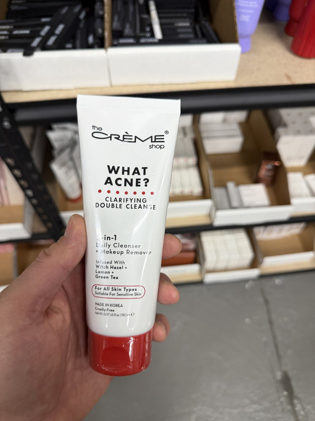 The Crème Shop What Acne? cleanser in hand