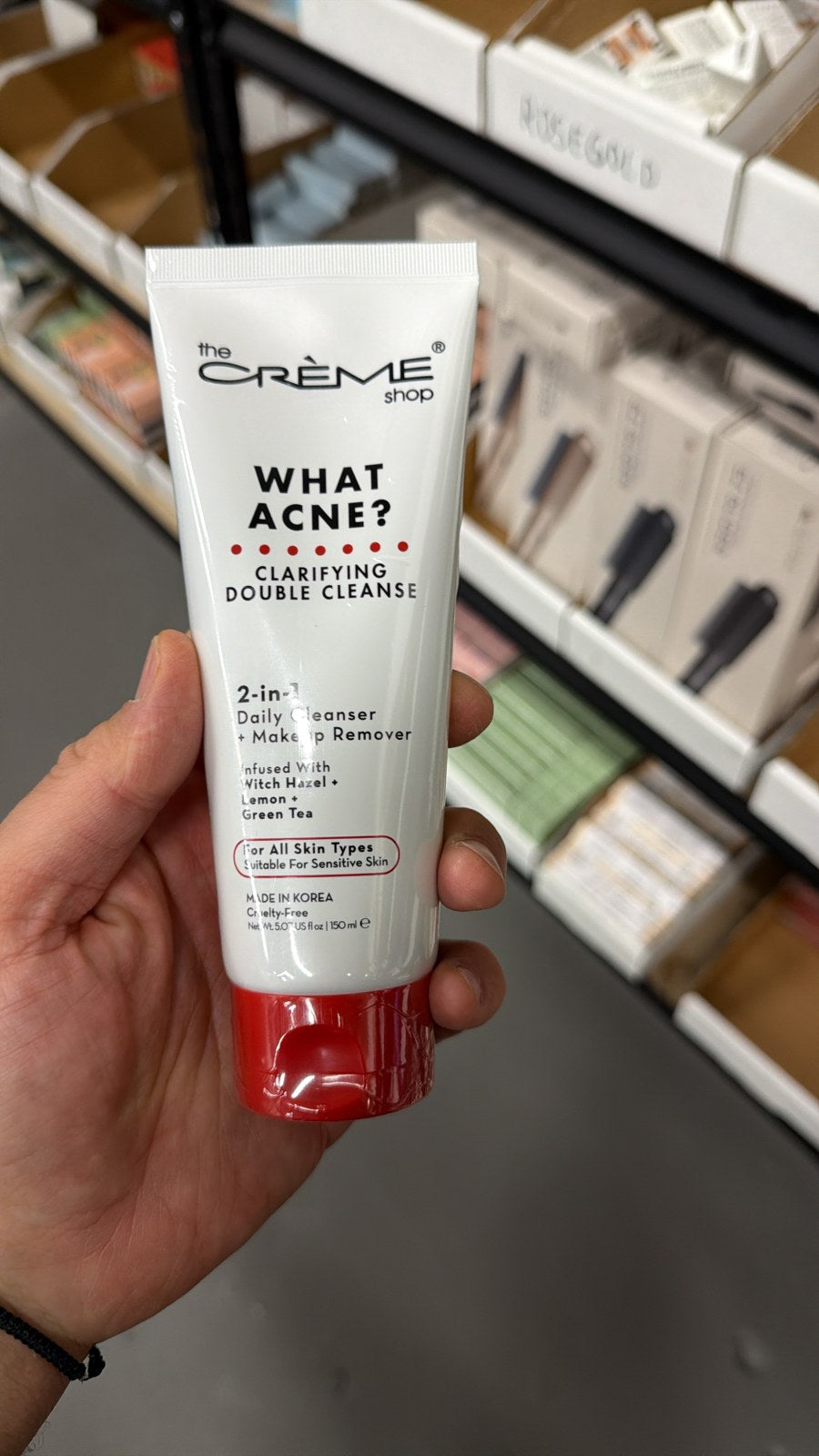 The Crème Shop What Acne? cleanser in hand, second view