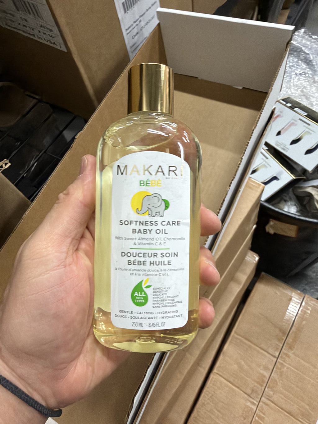 Makari Bébé Softness Care Baby Oil in hand