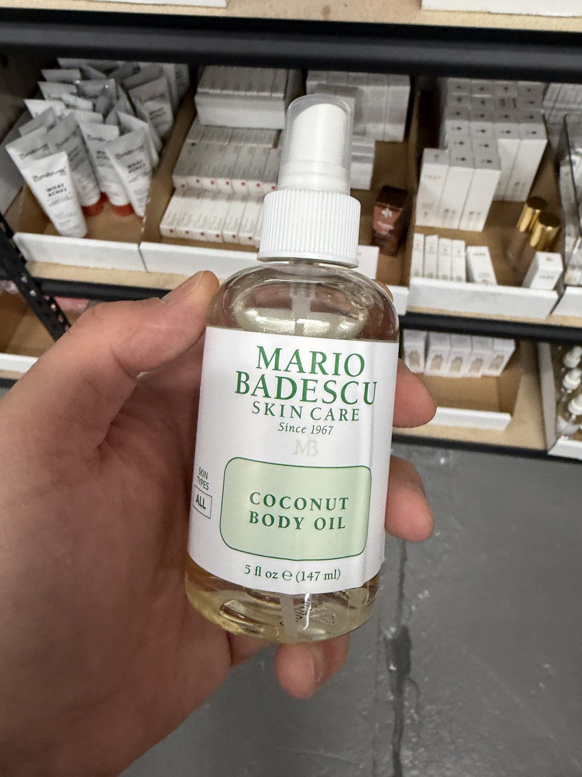 Mario Badescu Coconut Body Oil in hand