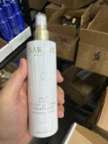 Nakery Beauty Lift-TOX SkinFirm Body Lifting Treatment 250 mL spray bottle in hand