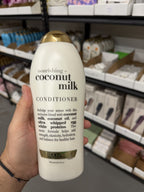 OGX Coconut Milk Conditioner in hand