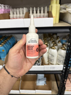 Rhyme & Reason Damage Repair Serum in hand
