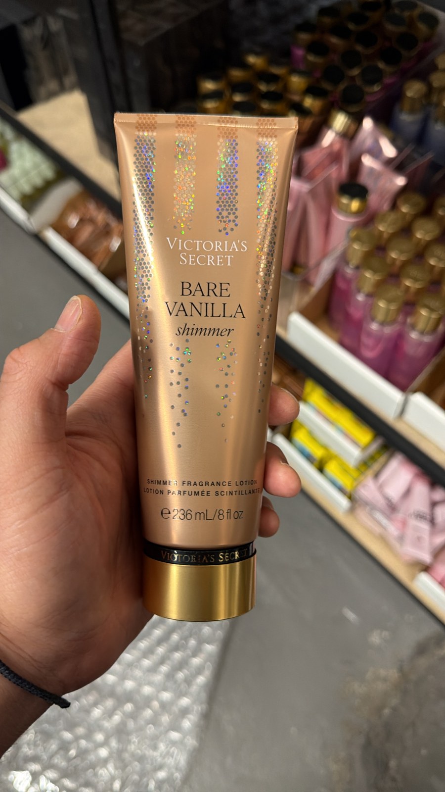 Victoria's Secret Bare Vanilla Shimmer Fragrance Lotion in hand