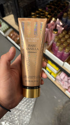 Victoria's Secret Bare Vanilla Shimmer Fragrance Lotion in hand
