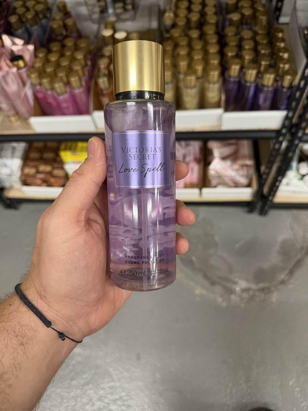 Victoria's Secret Love Spell Fragrance Mist in hand