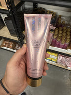 Victoria's Secret Velvet Petals Shimmer Fragrance Lotion in hand